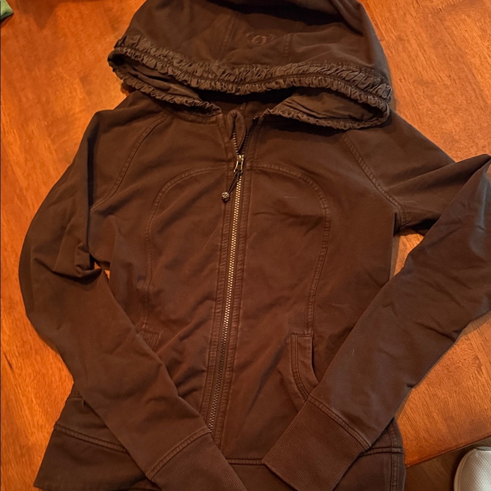 Lululemon black zip hoody sweatshirt with ruffle gathered hood detailing.